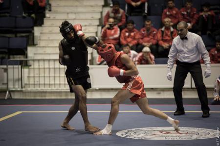 Thomas Nguyen (en rouge) pendant le Championnat du monde de Sanda 2014.