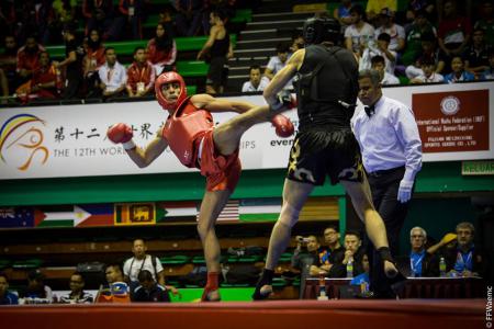 Thomas Nguyen (en rouge) pendant le Championnat du monde de Sanda 2014.